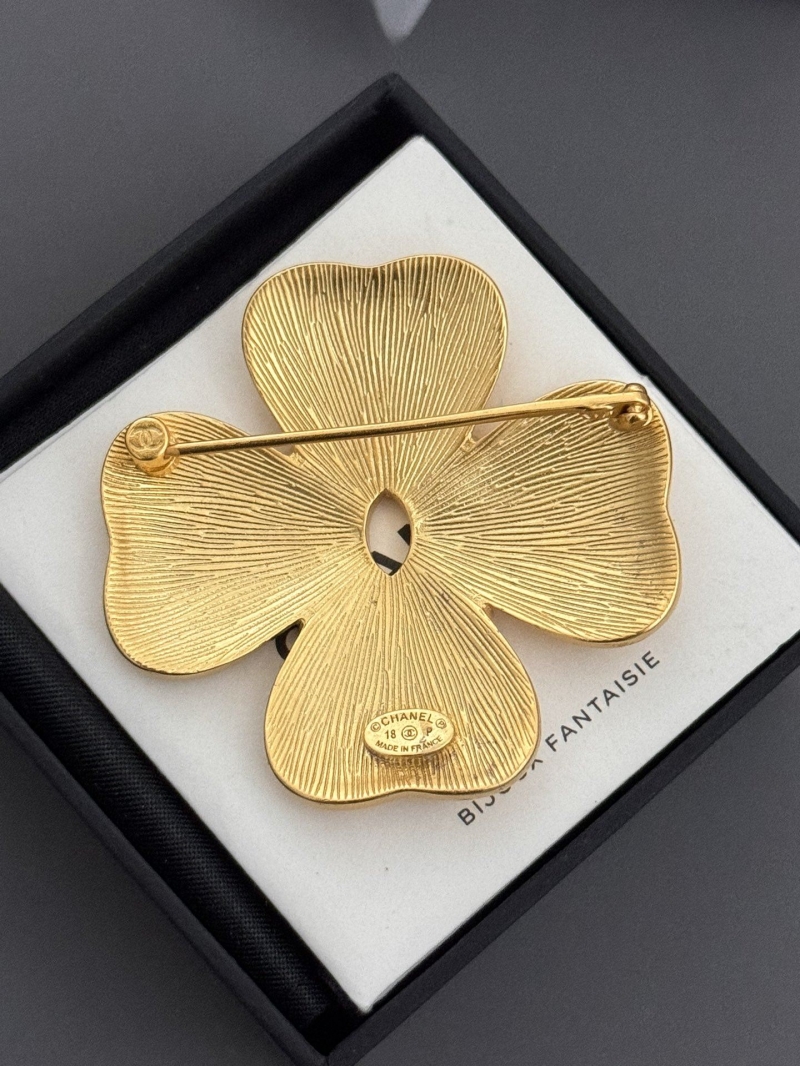 Ch**el brooches